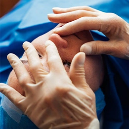 Laurie A. Casas, MD examining patient's foot for podiatry assessment or foot pain diagnosis