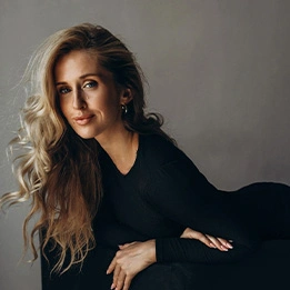 Professional portrait of blonde woman in black outfit with elegant styling and natural lighting - Radiesse in Chicago, IL
